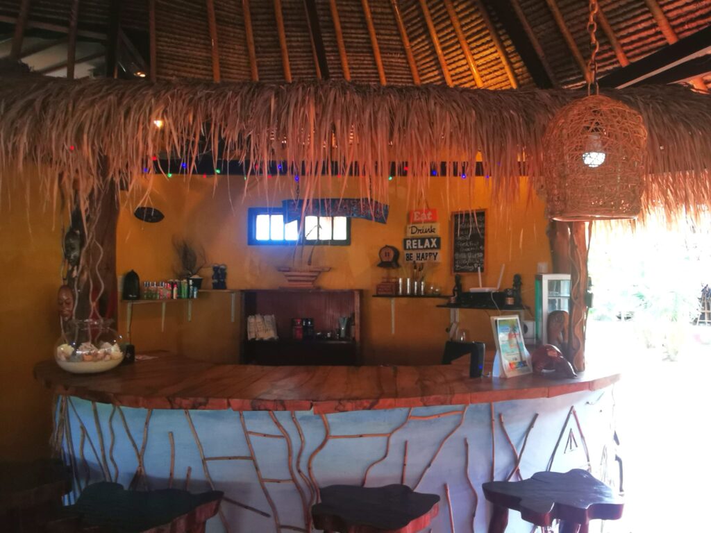 Snack Bar counter under a thatched roof at Kampung Meno Bungalows