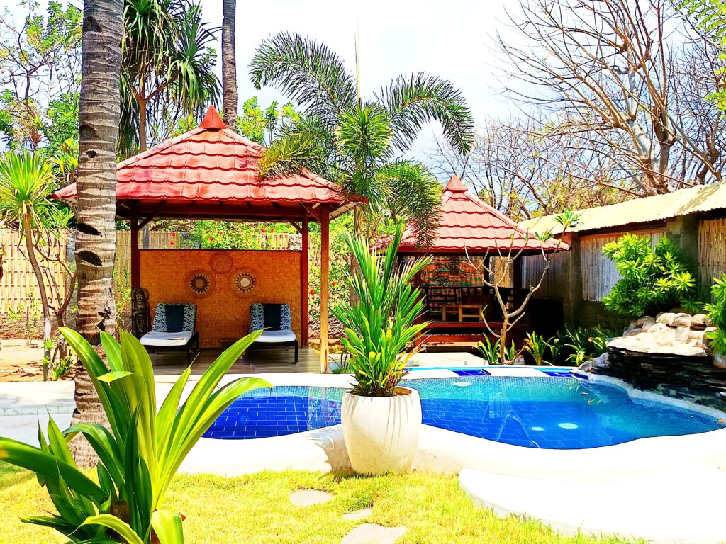 Swimming pool and garden gazebos at Kampung Meno Bungalows on Gili Meno