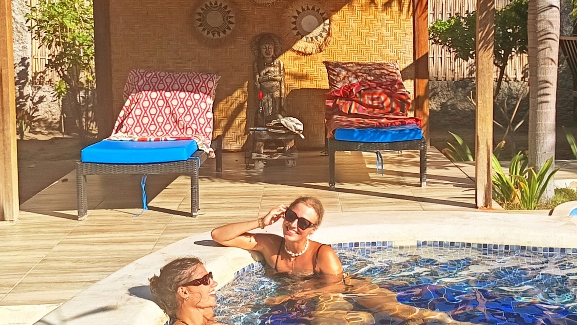 Guests relaxing in the swimming pool at Kampung Meno Bungalows on Gili Meno